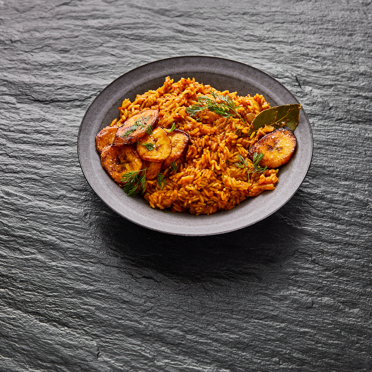 Nigerian Jollof Rice with Chicken and Fried Plantains Recipe